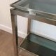 Beautiful console table in brushed metal with bluish glass shelves