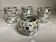Four mosaic mirror and mother-of-pearl candle holders.
