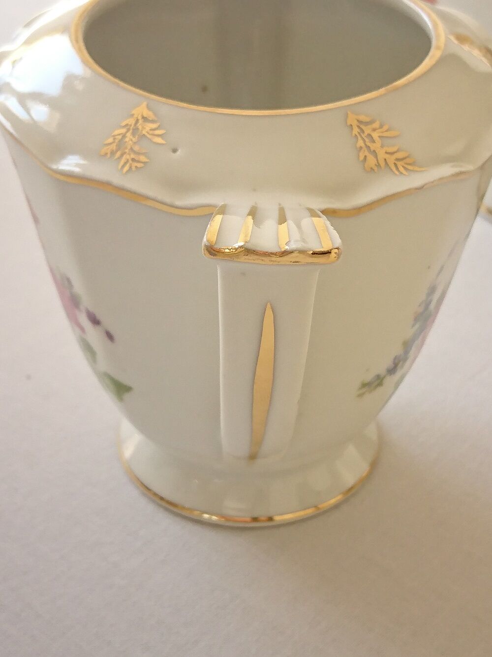 Sugar bowl and milk jar in flowery white porcelain