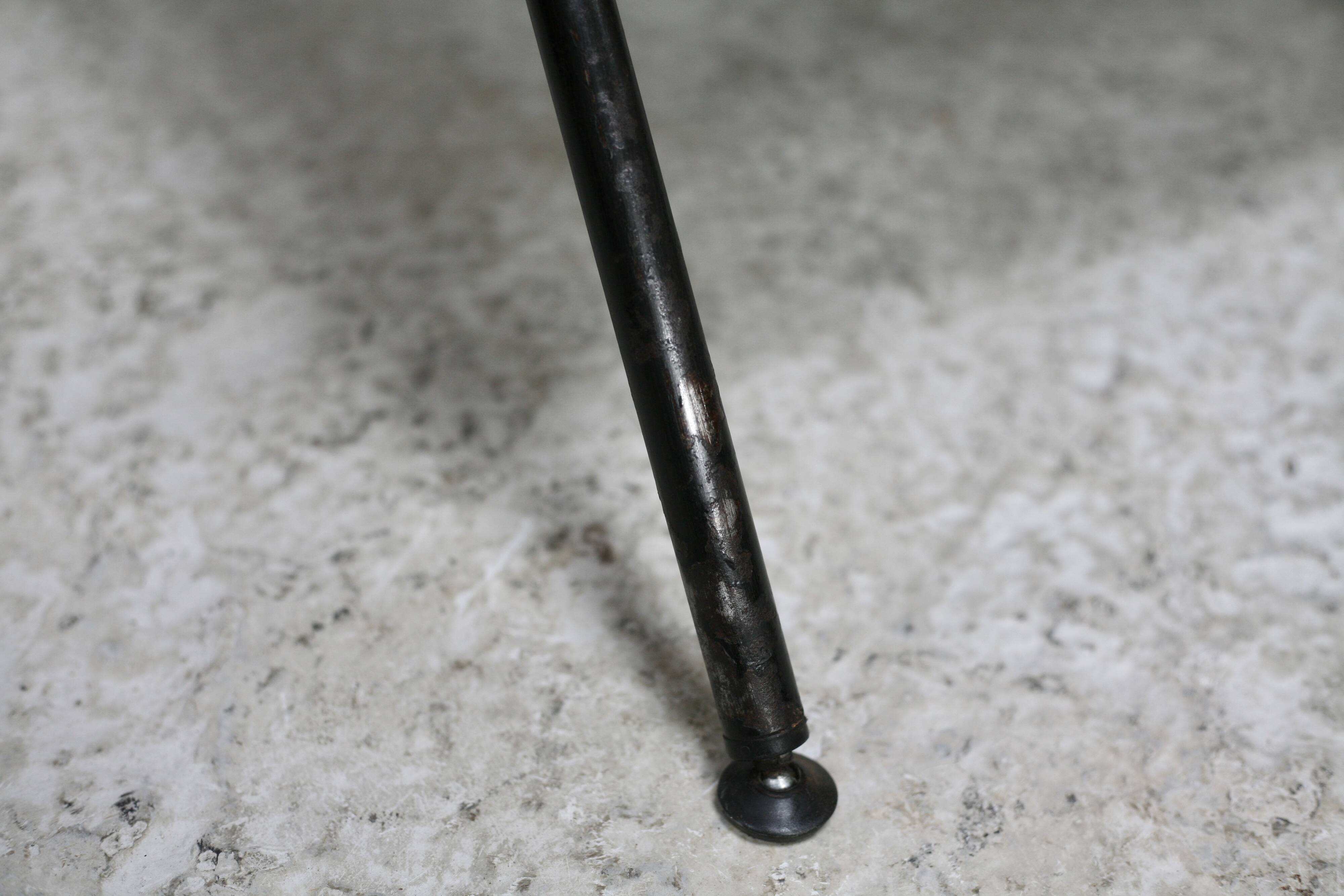 Low chair, circa 1950. Brown imitation leather.