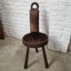 Antique tripod chair in solid wood and animal skin.