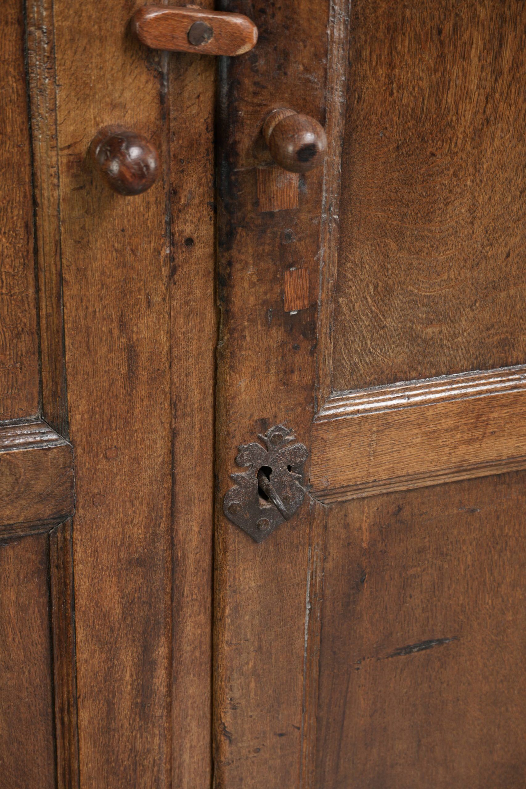 Antique oak farmhouse cupboard from the 17th century with original fittings