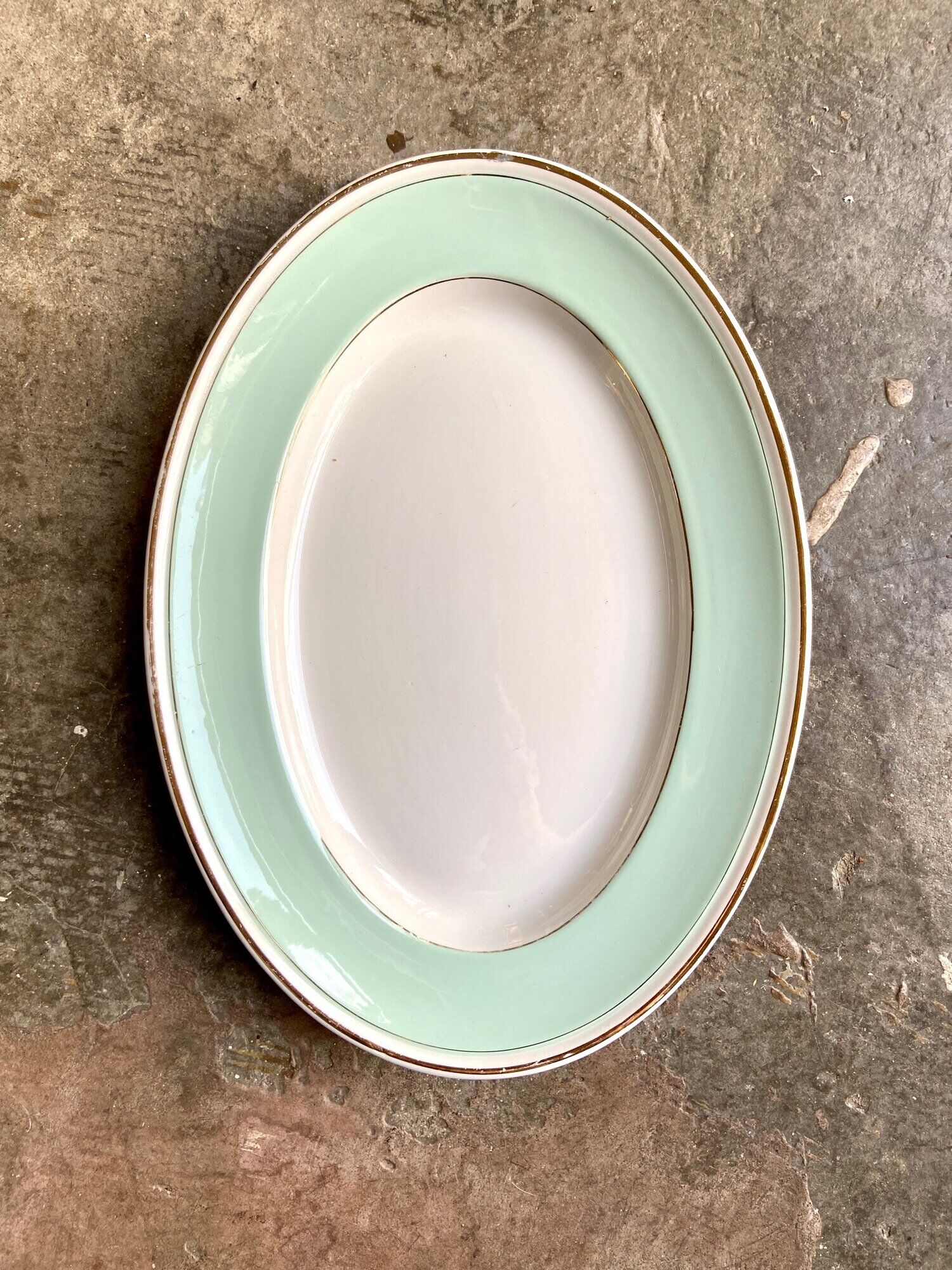 Luneville oval dish in water-green and golden opaque porcelain