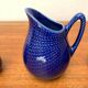 Swedish Salier Mid-Century Bla Eld, Salt Shaker, Milk Jug, Saucer and Plate by Hertha Bengtson for Rörstrand, 1960s, Set of 4