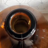 Great old demijohn in amber glass