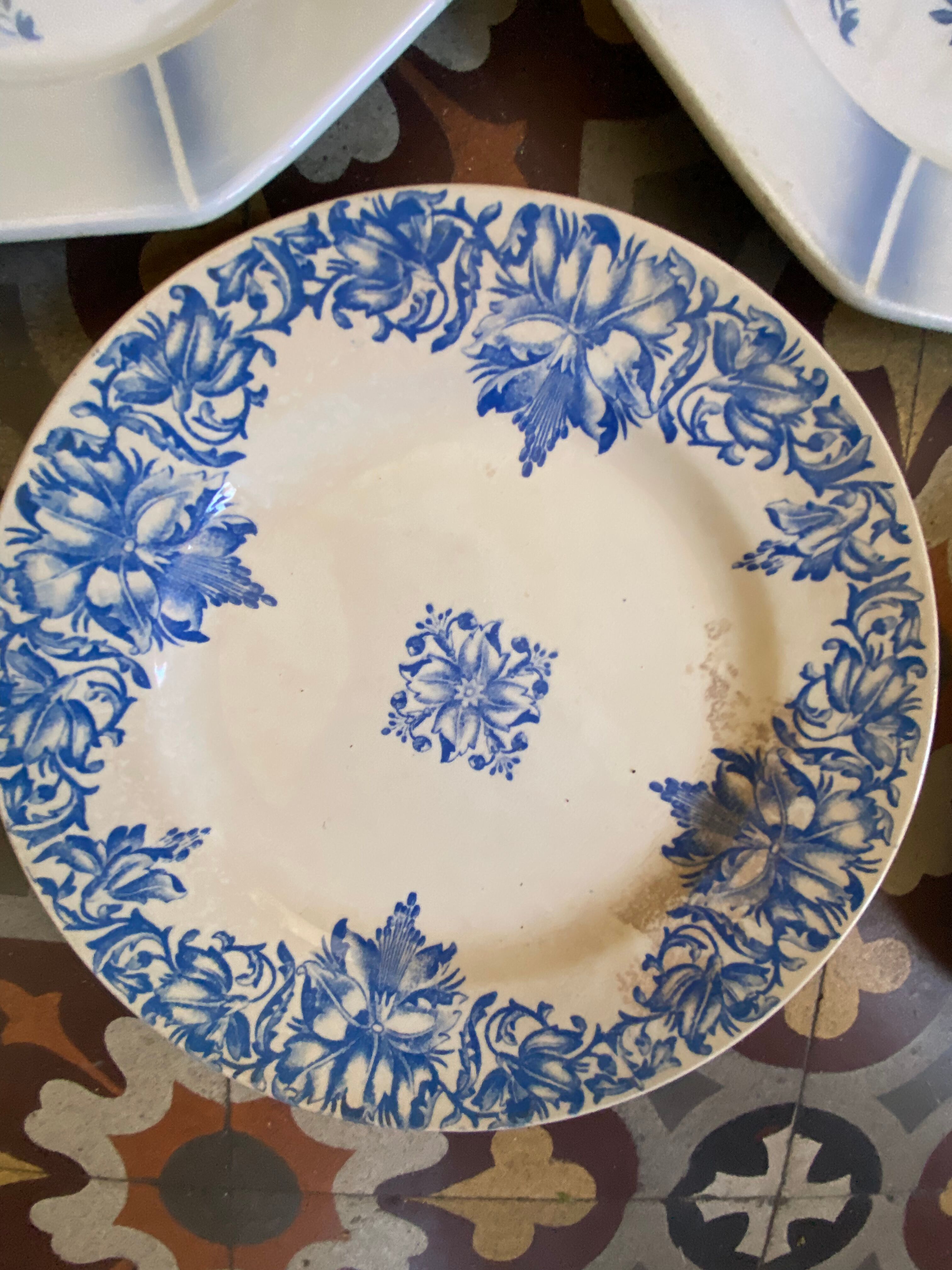 7 matching dessert plates in red green and blue.