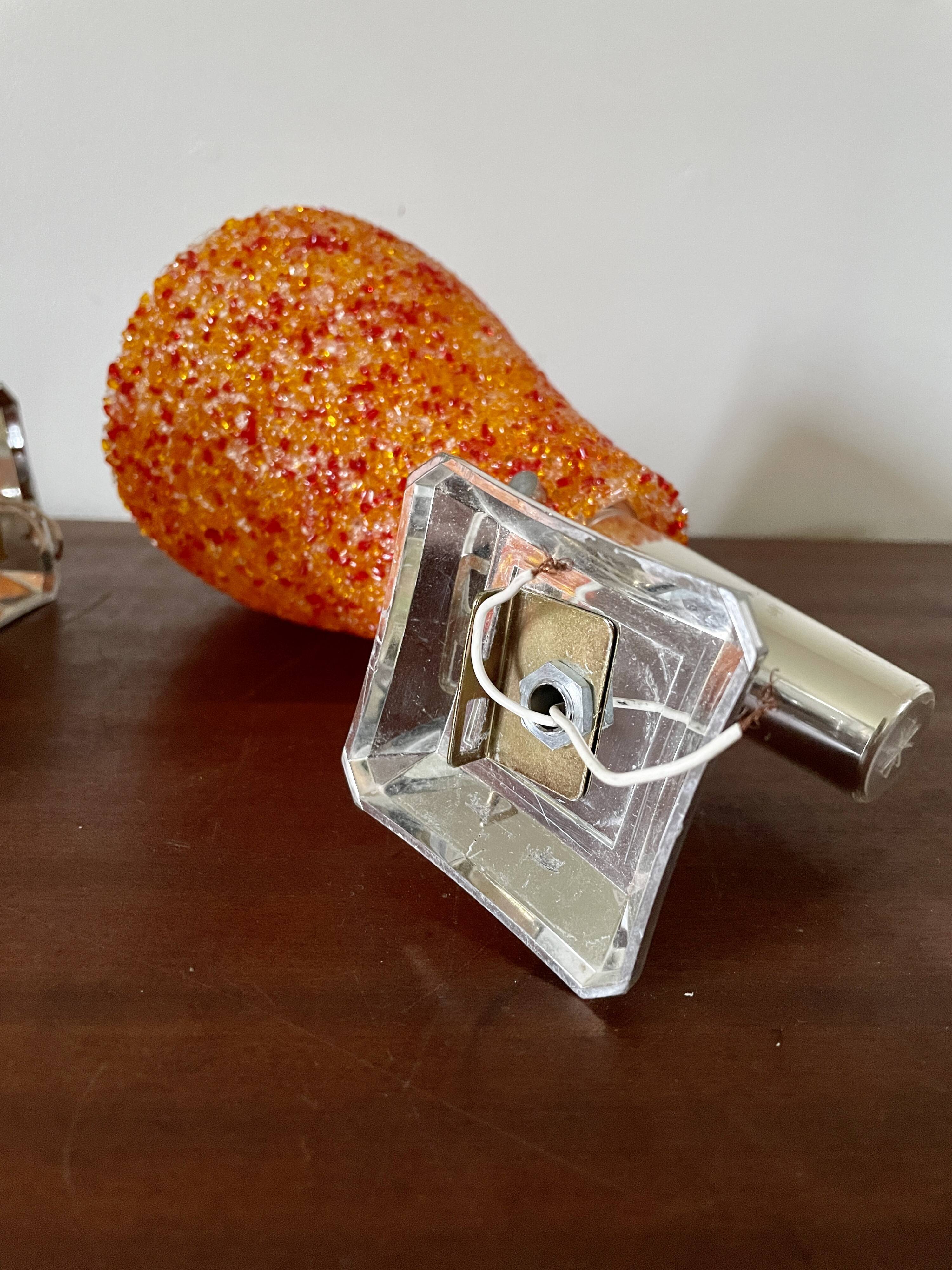 Pair of orange perspex wall lights from the 1950s.