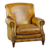 Fauteuil confortable de style anglais en cuir jaune de grande taille avec une finition soignée et des clous décoratifs