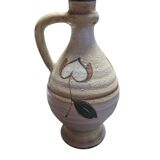Handcrafted jug or jar with a handle, terracotta pottery vase, fat lava effect, stylized flowers