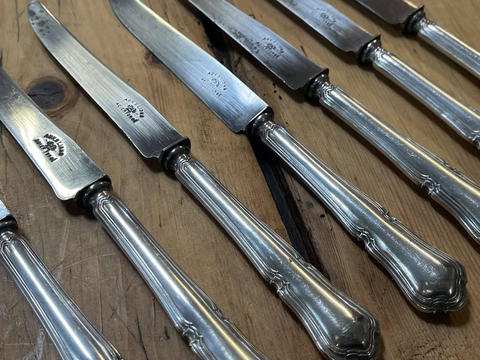 Set of 12 dessert knives in silver metal with steel blades from the early 20th century