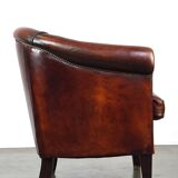 Very luxurious dark brown sheepskin club chair with a more than beautiful patina