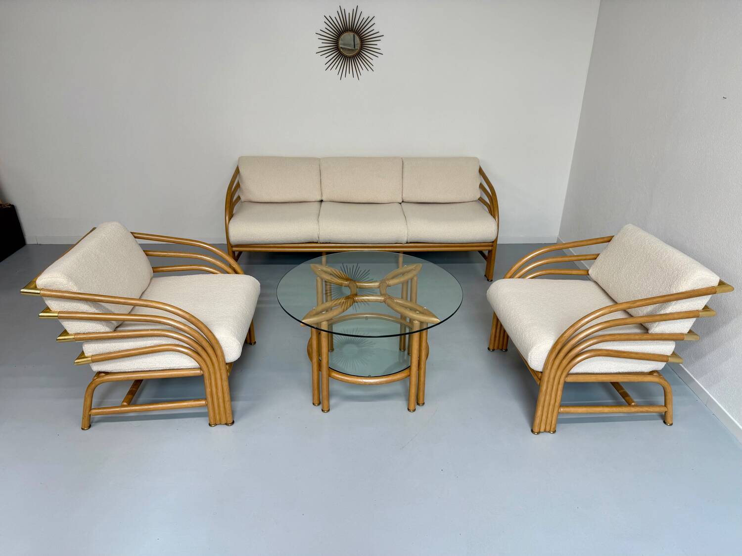 Complete living room with rattan sofa and white bouclette, brass finish, 80's design