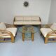 Complete living room with rattan sofa and white bouclette, brass finish, 80's design