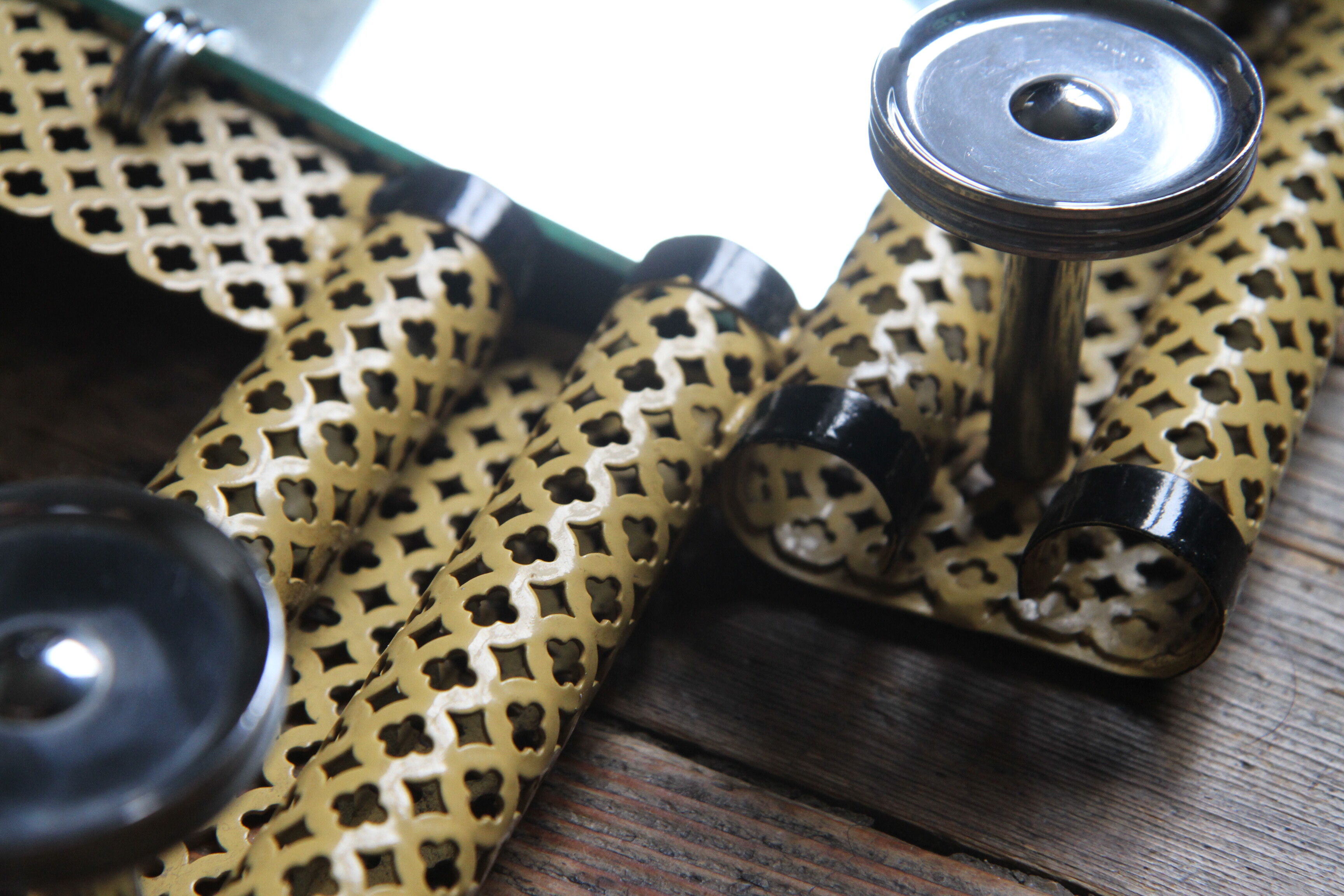 1950s perforated metal coat holder