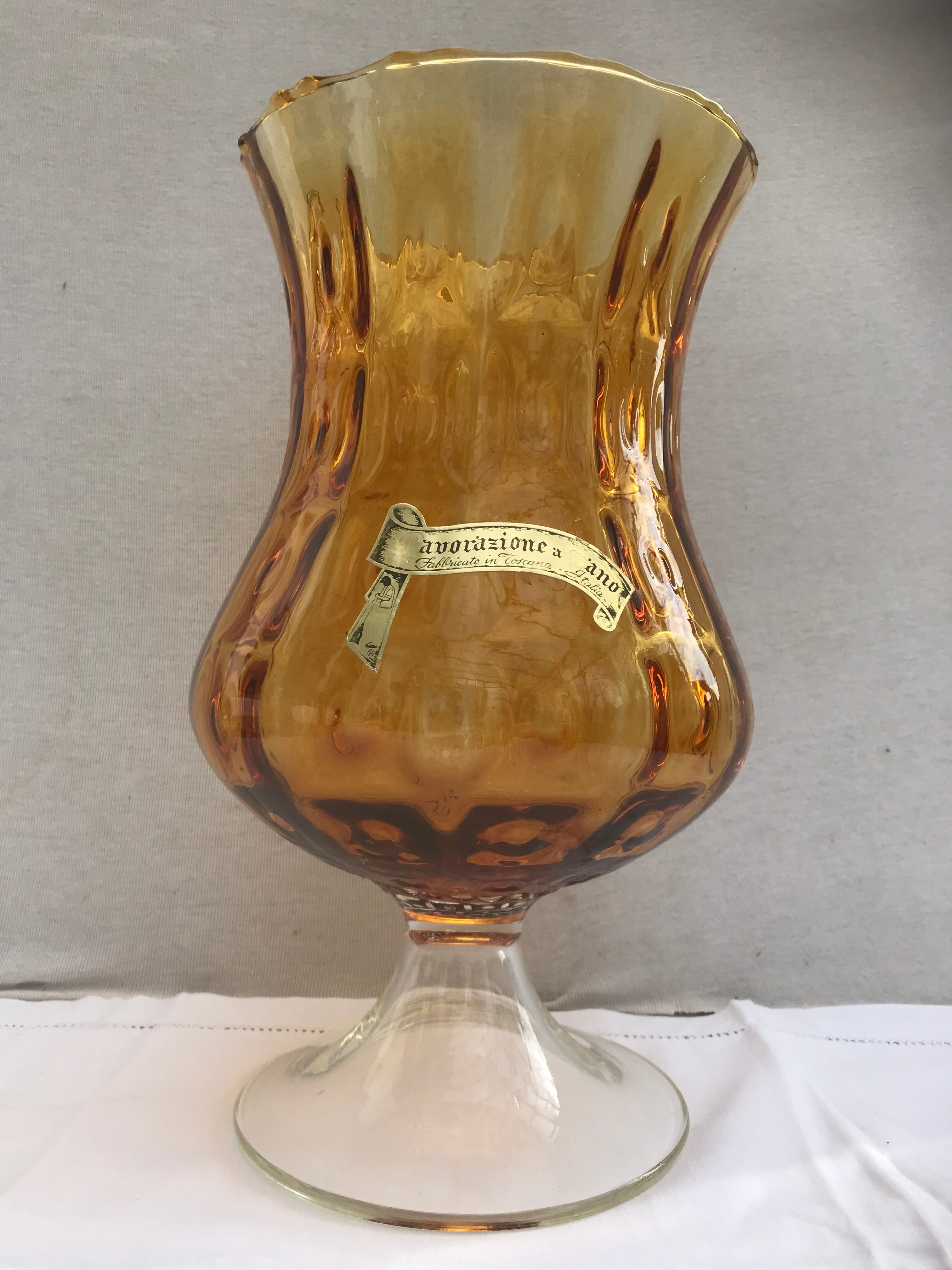Ancient vase on foot orange glass