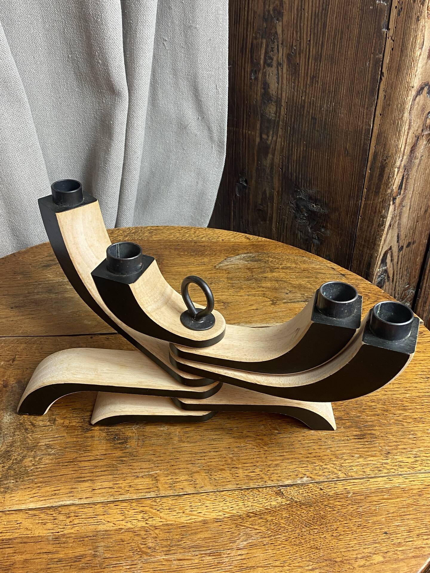 Foldable and deconstructed chandelier, minimalist Swedish design in wood.