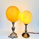 Ostrich egg lamp on a brass stand, antique curiosity cabinet.