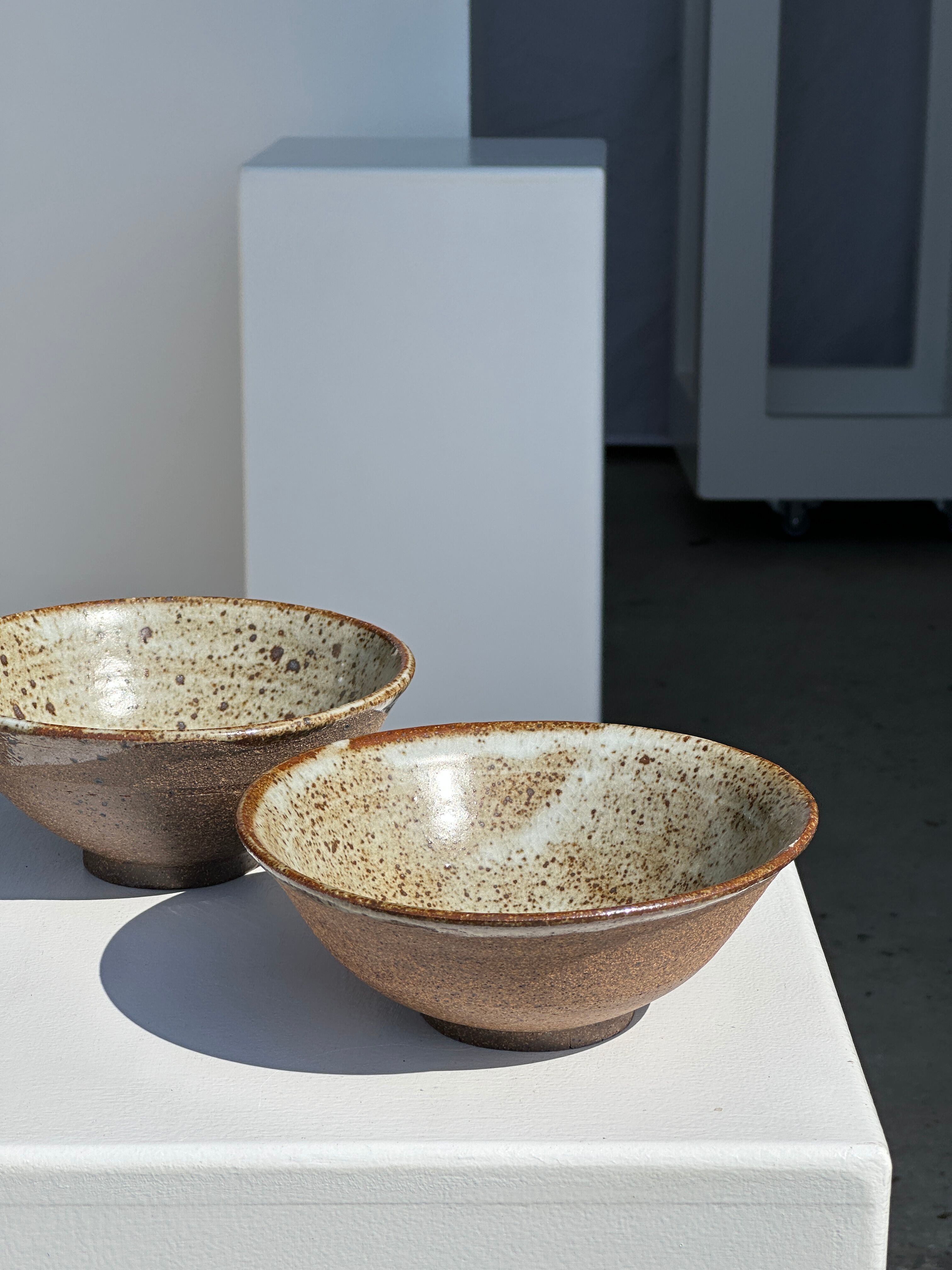 Duo of ceramic bowls interior glazed exterior matt raw earth