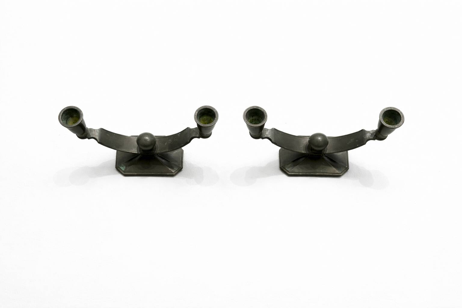 Art Deco candlestick pair by Just Andersen in Disko metal.