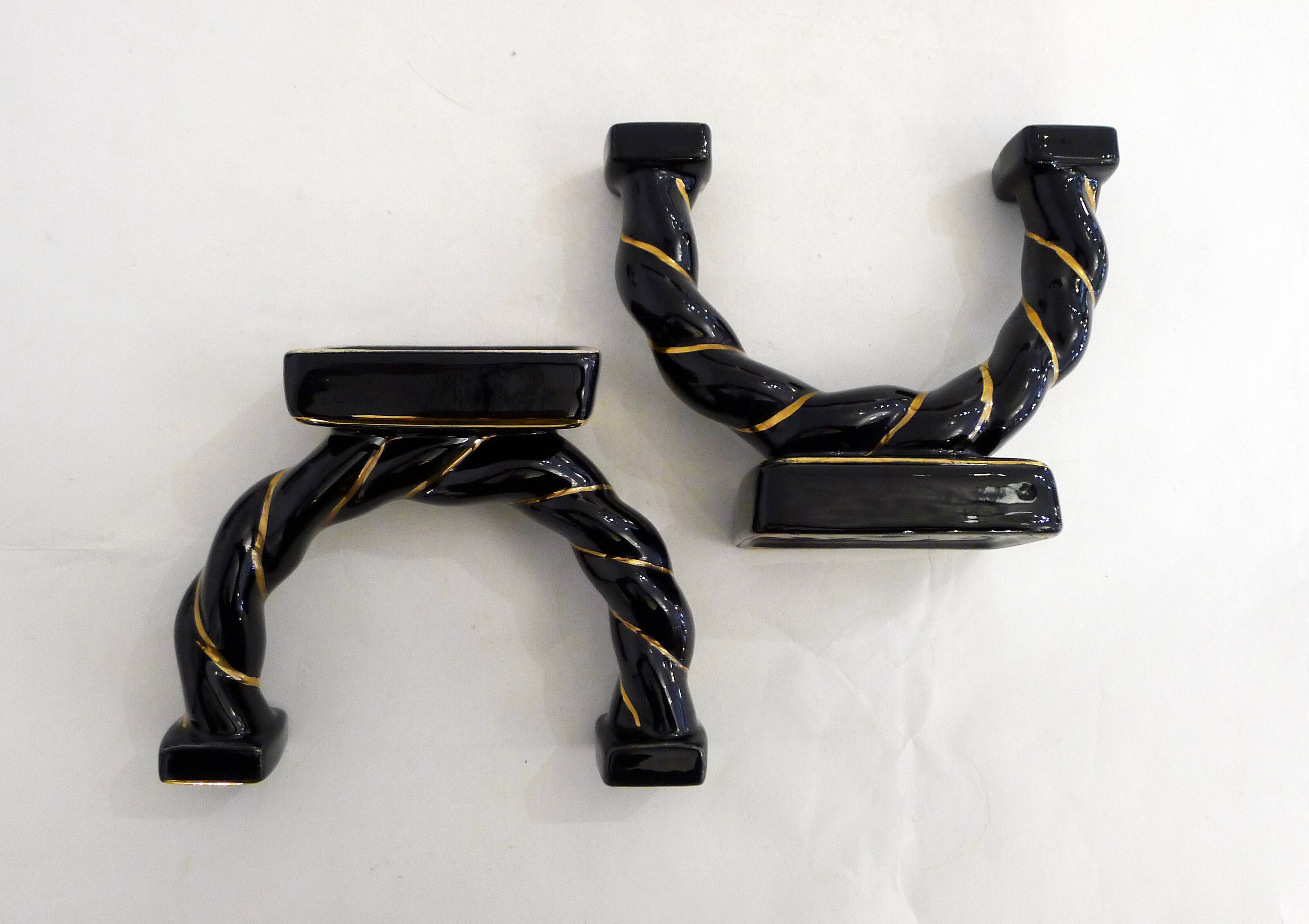 Pair of earthenware braided rope candlesticks