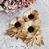 Low brass flower candle holder