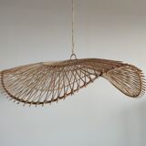 Rattan suspension or lighting fixture in the shape of an undulating circular tray with lattices