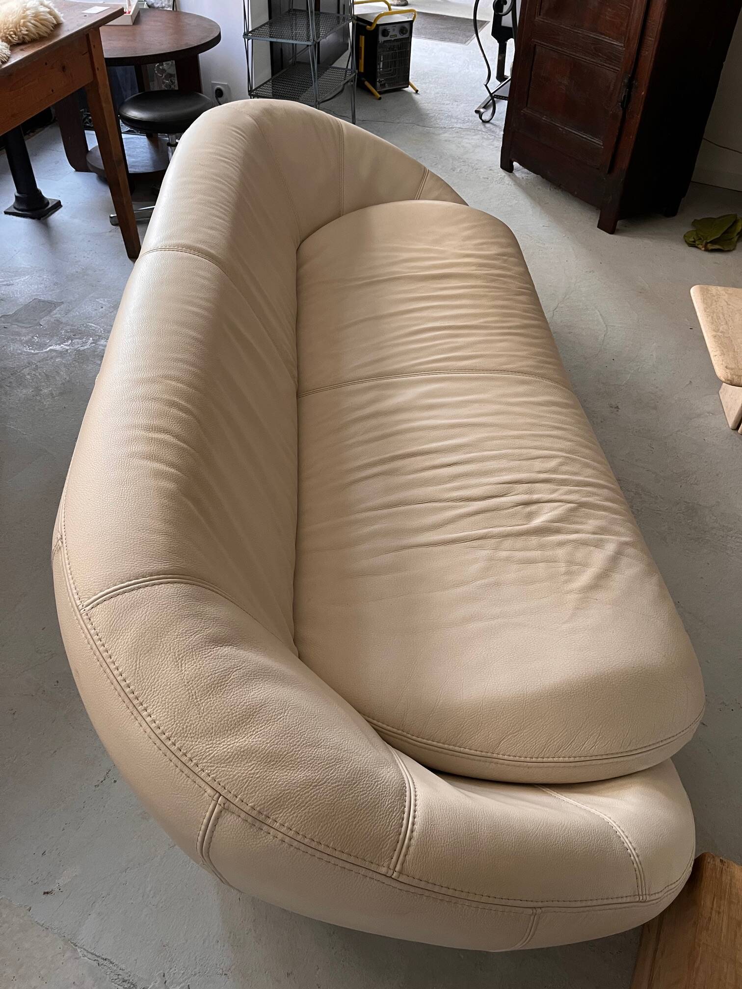 Rounded off-white leather sofa