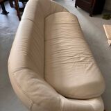 Rounded off-white leather sofa