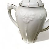 Porcelain coffee pot with floral pattern and silver stem