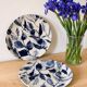 Two flat plates in earthenware with blue floral decoration.