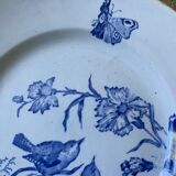 Plate decorated with blue birds and butterflies