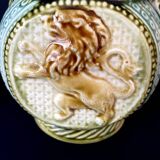 Small onnaing barbotine jug with lion decoration