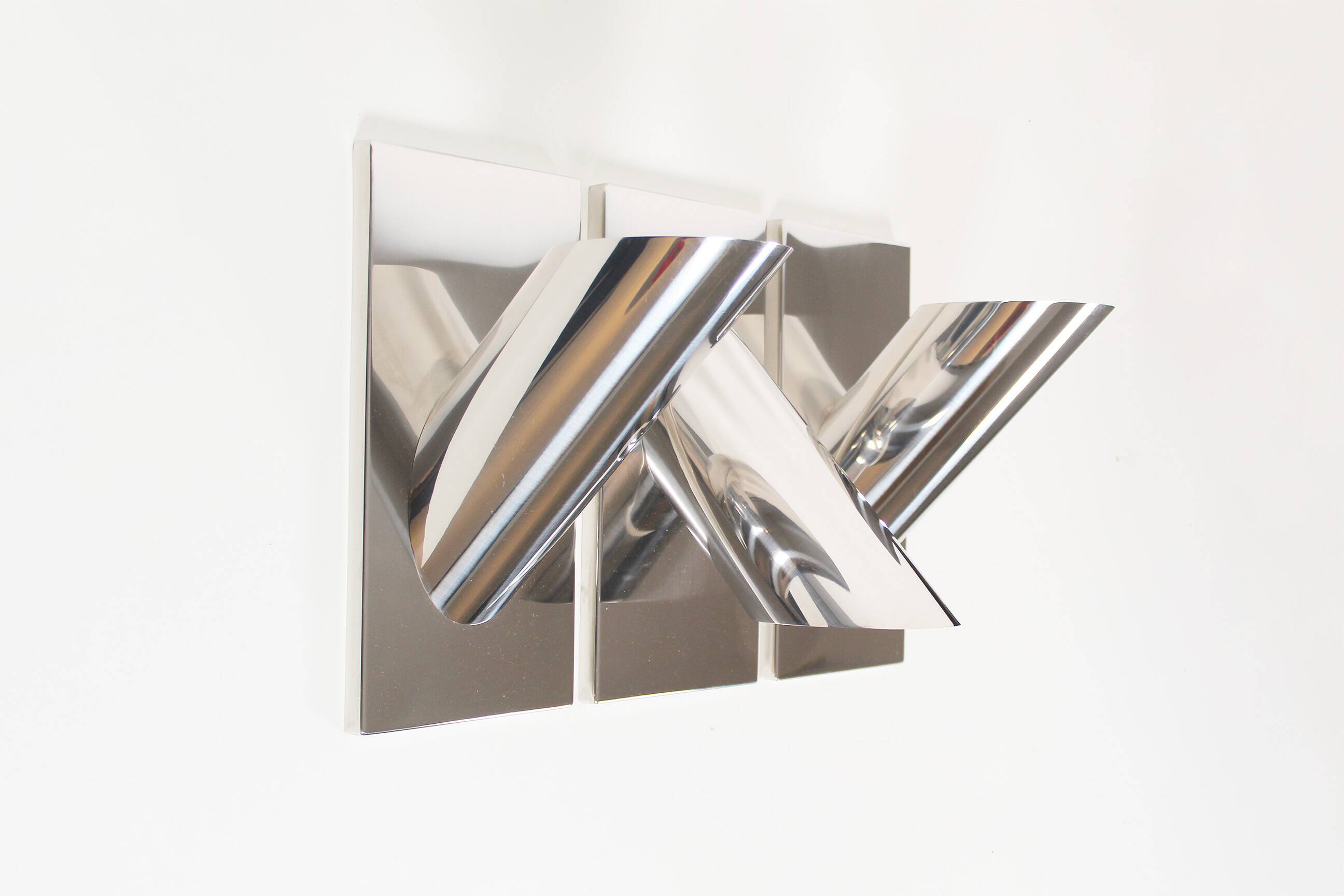 Set of three large sculptural vintage chrome metal wall lights