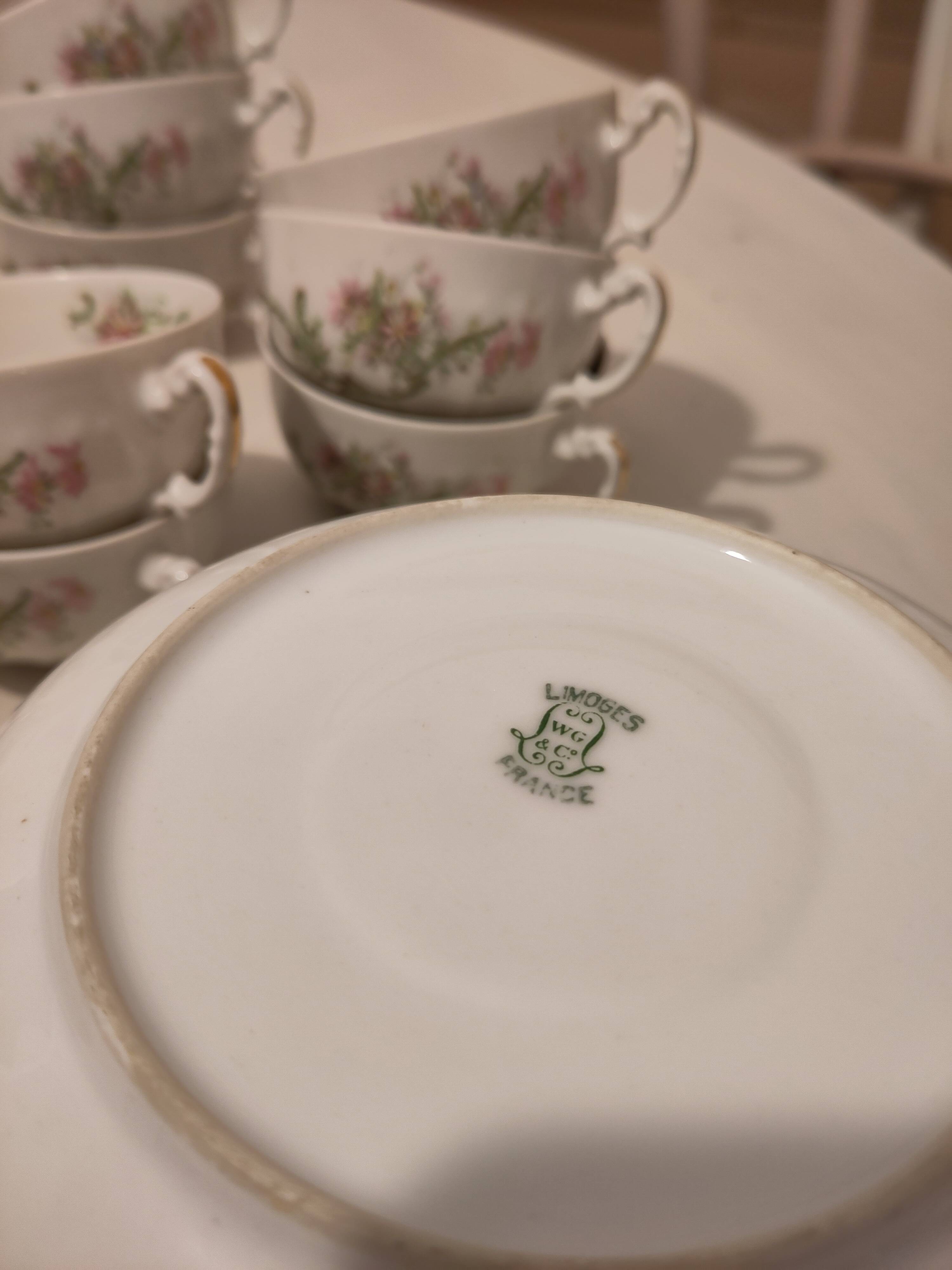 Coffee and tea cup service with plates and saucers.