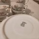 Coffee and tea cup service with plates and saucers.