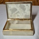 Rectangular light onyx jewellery box with brass trim, empty.