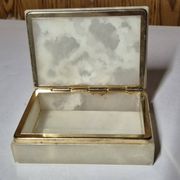 Rectangular light onyx jewellery box with brass trim, empty.