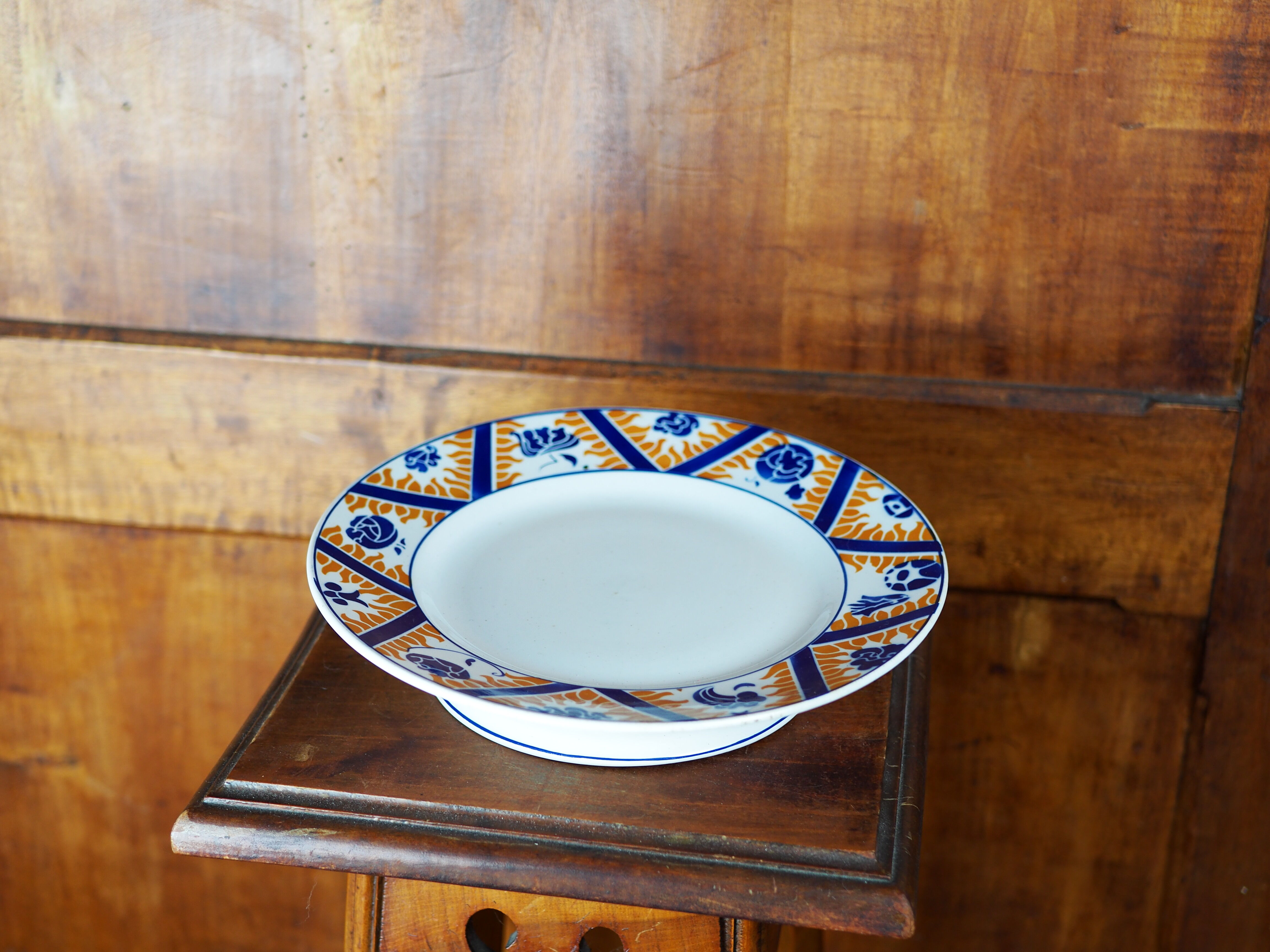 Earthenware cake dish patterned with flowers, clouds and flames, orange and blue - Orchies - 50s