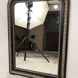 Napoleon III curved mirror, blackened wood frame with cream trim