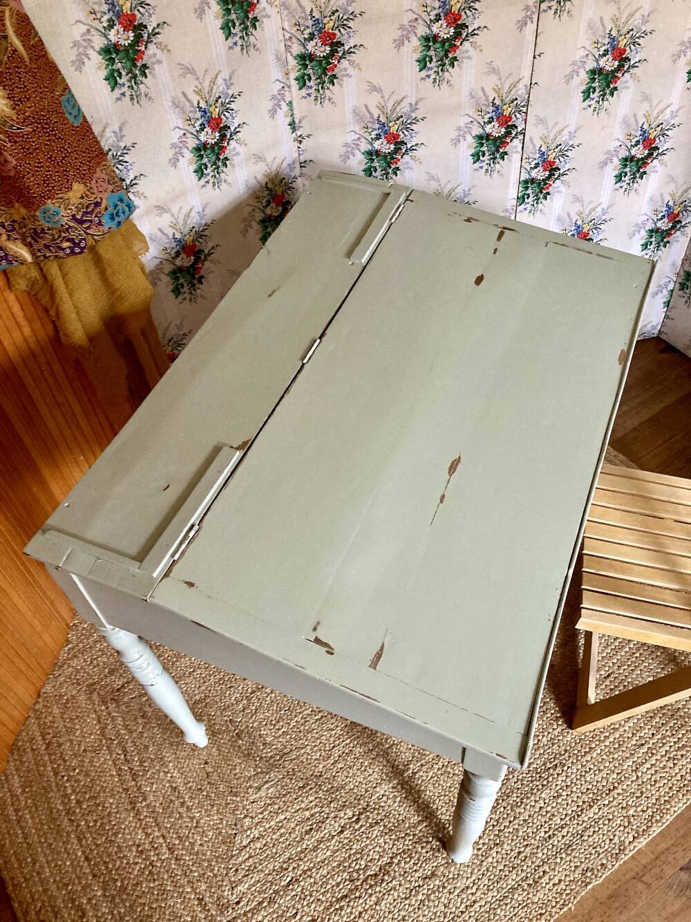 Antique wooden sloped desk, with a drop-down front and turned legs.