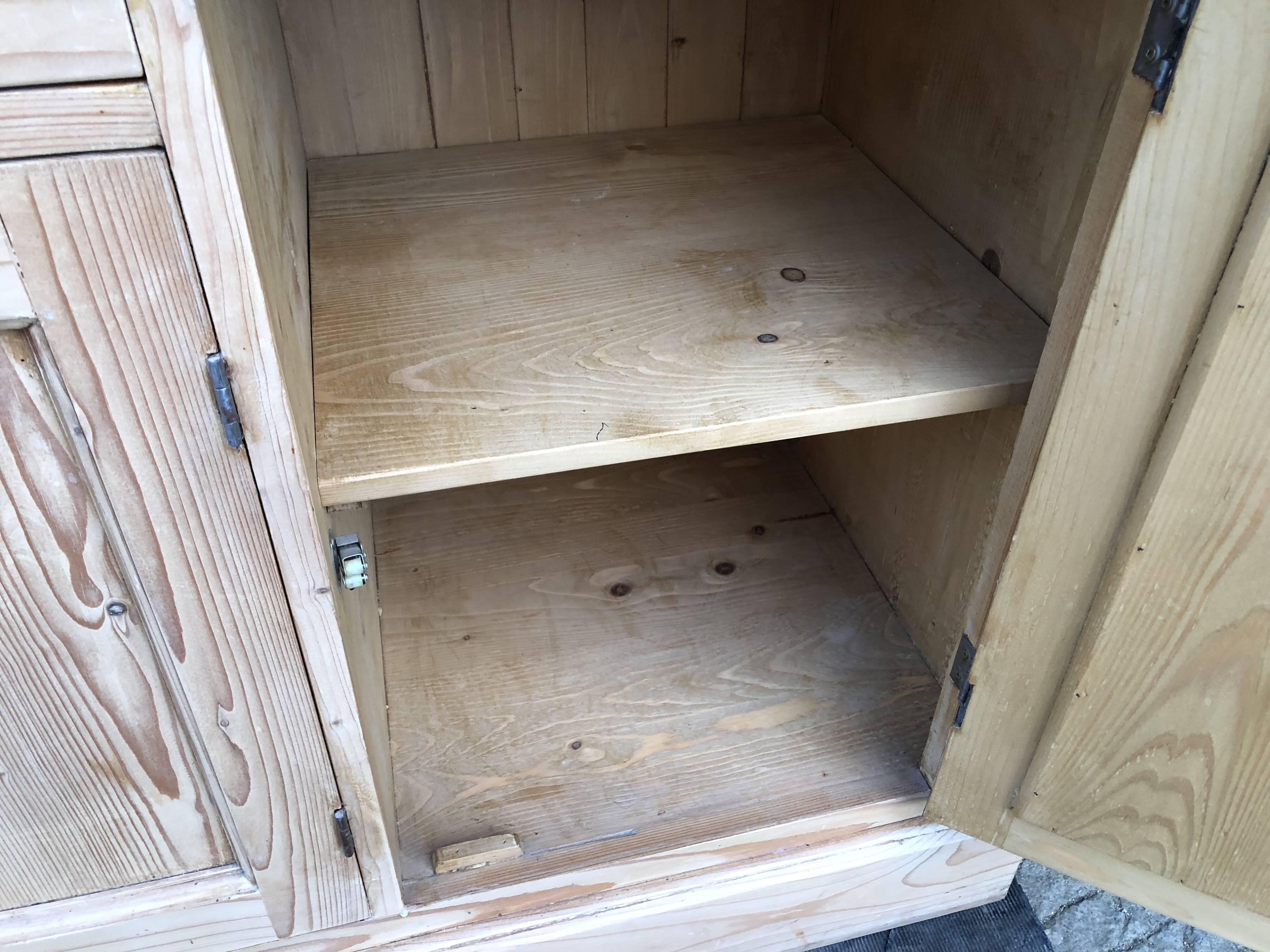 Scandinavian natural pine sideboard with 4 doors and 6 drawers.