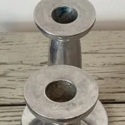 Pair of minimalist polished aluminium candle holders
