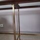 Glass and brass console table