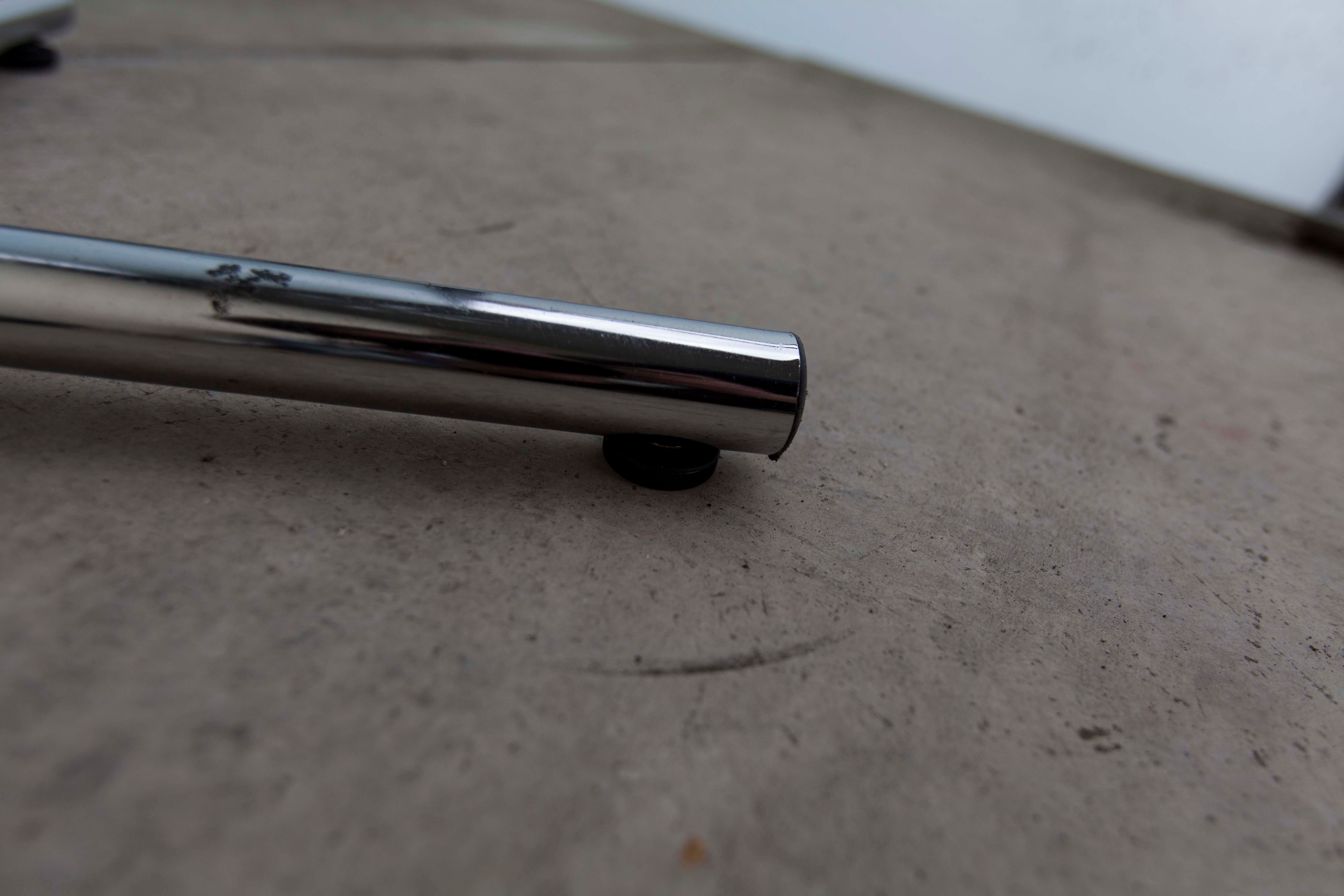 Chrome metal parrot coat holder from the 70s