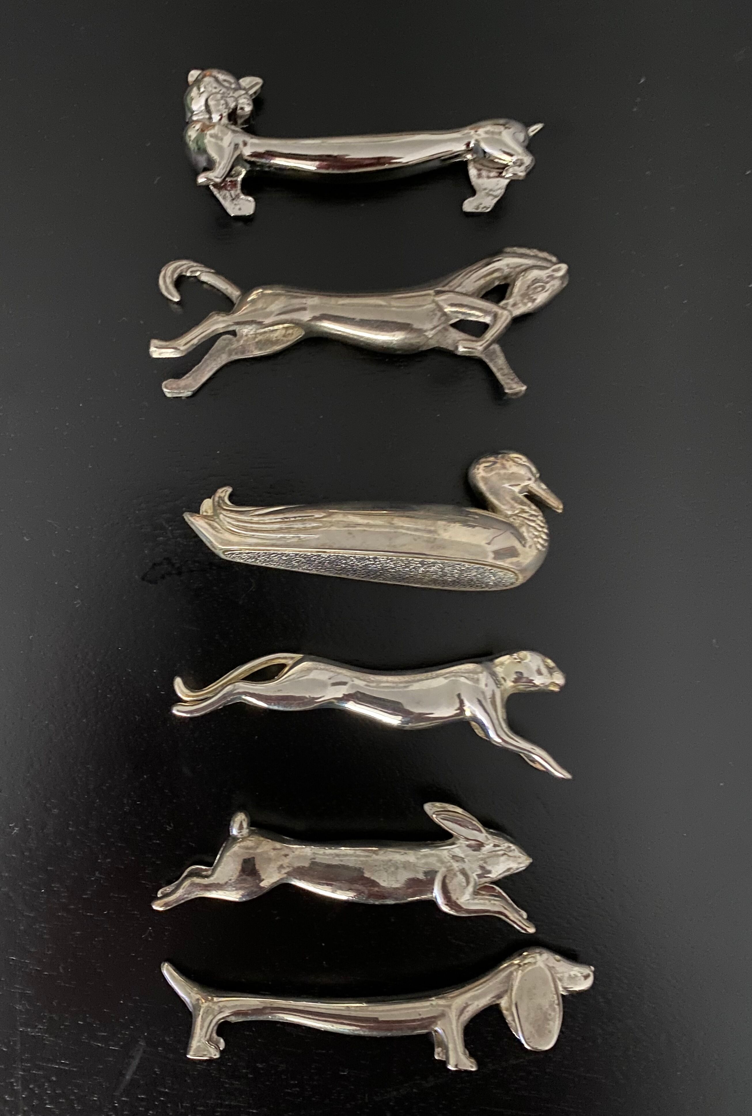 12 knife holders form various metal animals
