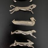 12 knife holders form various metal animals