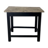 Old blackened wood work table and varnished top