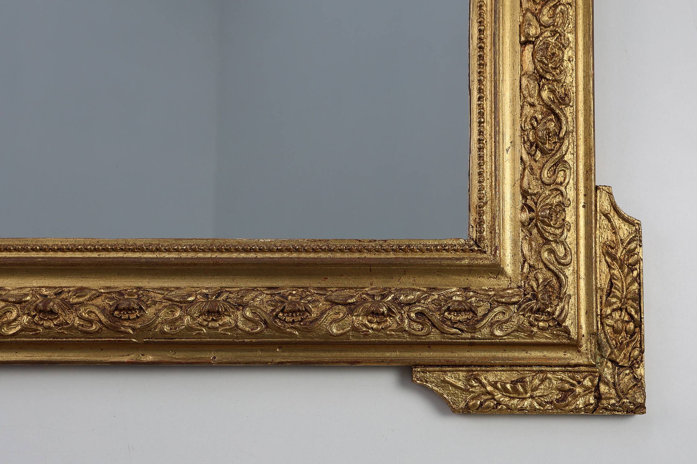 French rococo style richly sculpted gilted oak mirror, 19th century