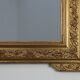 French rococo style richly sculpted gilted oak mirror, 19th century
