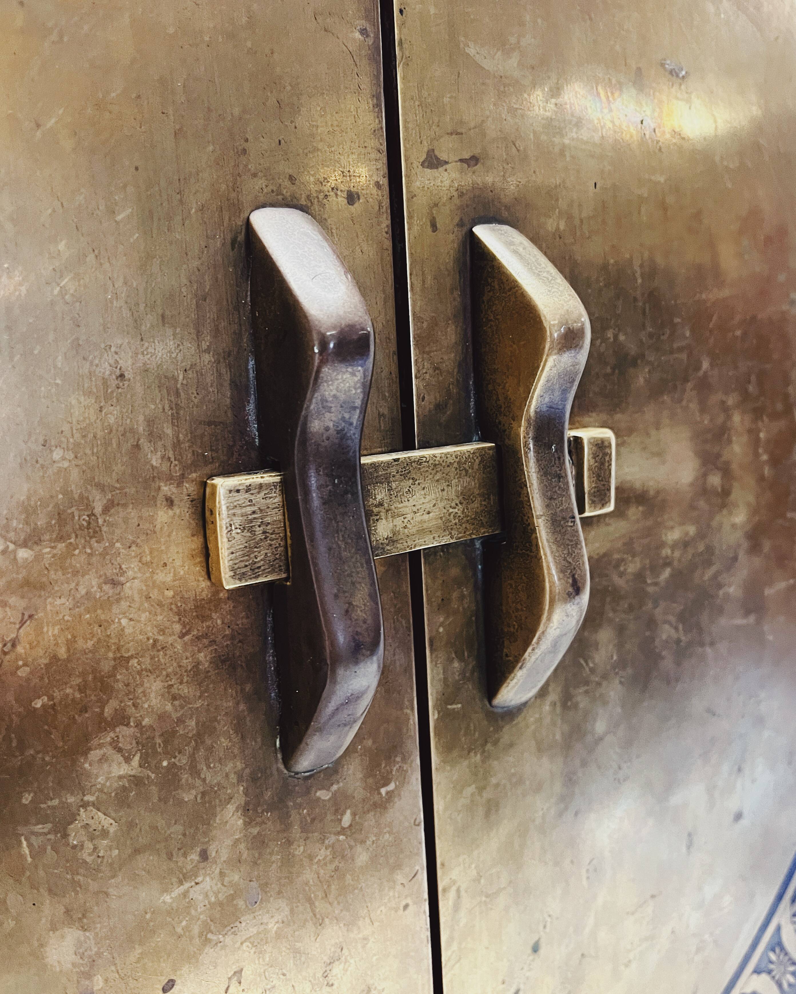 Antique red cabinet with brass details